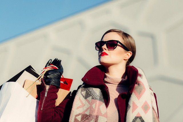 A woman after shopping in her favorite and trusted store.